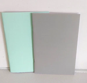 2 EXERCISE BOOKS 40 RULED PAGES 1 PALE TURQUOIS & 1 PALE GREY PLAIN COVER - Picture 1 of 2