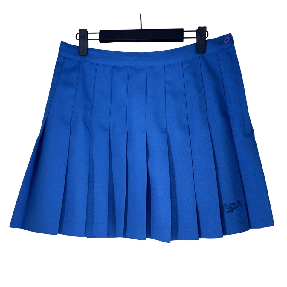 Falda deportiva plisada Reebok para mujer talla 14 azul tenis golf Skort años 90 Y2K usada en excelente estado Foto 1 de 4
