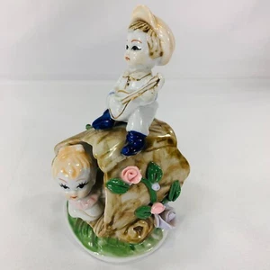 Figura de porcelana china de niños jugando alrededor de un tronco hueco - Imagen 1 de 10
