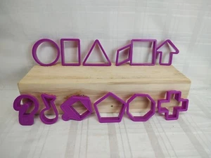 Formas Cortadores de Galletas Molde Plástico Púrpura Triángulo Ovalado Cuadrado Cruz Lote de 12 - Imagen 1 de 5