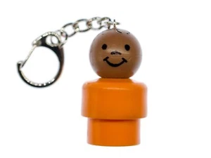 Fisher Price Little People Figur Vintage Retro Schlüsselanhänger Baby Orange - Bild 1 von 3