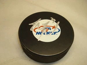 Disco de hockey autografiado por el equipo firmado de Justin Faulk 1A - Imagen 1 de 2