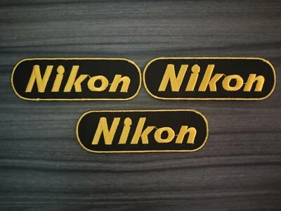 Logo Nikon black ground Iron on Patches Embroidered Sew on Jean Jacket Hat Bag - Image 1 of 4