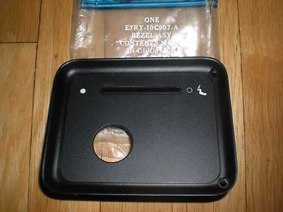 NOS 1988 MERKUR SCORPIO SEAT BELT WARNING INDICATOR BEZEL - Image 1 of 2