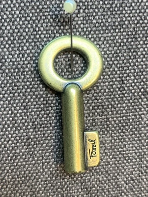 Bolso de llaves fósiles solo llave dorada Foto 1 de 4