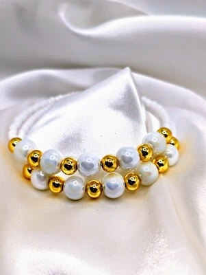 Pulsera de perlas de oro y porcelana de 18 quilates Foto 1 de 2