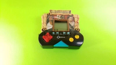 Lot of 3 Handheld Video Games, Pirates Caribbean, Boggle - Image 1 of 4