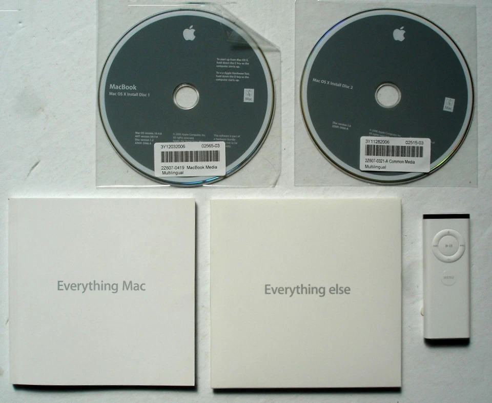 MacBook OS X 10.4.8 Install Discs + Booklets, A1156 Remote, Stickers - Image 1 of 1