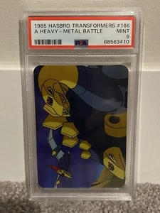 A Heavy Metal Battle (Dinobots) - 1985 Hasbro Transformers #166 - PSA 9 - Picture 1 of 1