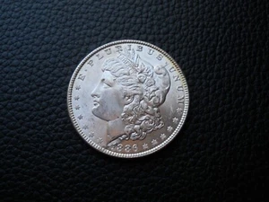 1886 Morgan Dollar w/Lamination Planchet Flaw (Unc) - Picture 1 of 4