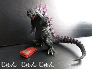 Figurina giocattolo Godzilla 2000 con minicar Ferrari rossa - Foto 1 di 8
