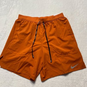 short nike laranja masculino
