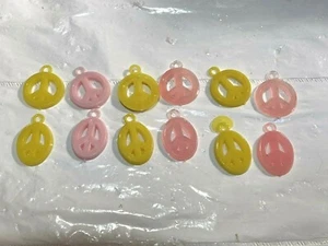 12 Vtg PEACE SIGN NECKLACE 60's 70's Toy Plastic Charms Pendant Pink Yellow - Picture 1 of 4