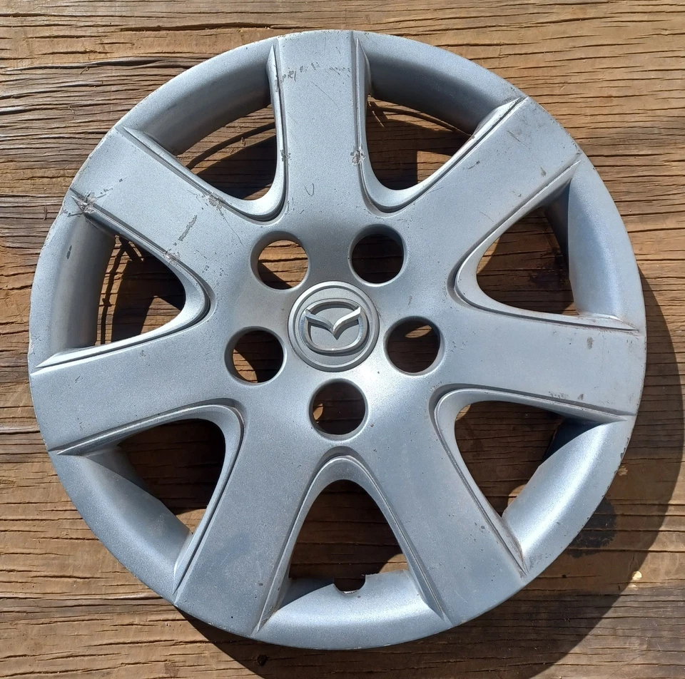 Mazda 3 hubcap 2007-2009 fits 15" wheels, part # 56553, BAN6 37 170 01 - Image 1 of 4