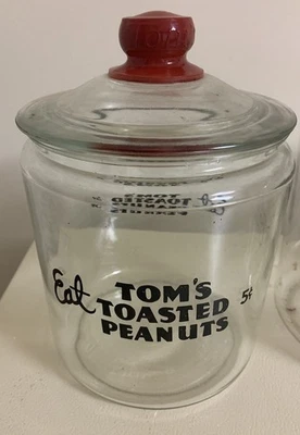 Vintage Counter Top Eat Tom's Toasted Peanuts Glass Jar 5 Cents Embossed Red Lid - Image 1 of 4