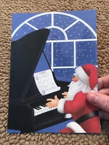 Tarjeta de Navidad vintage de Papá Noel tocando el piano Noel paisaje urbano Stephanie Stouffer - Imagen 1 de 5