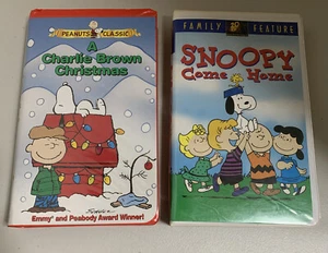 Lot (2) Peanuts VHS A Charlie Brown Christmas - Snoopy Come Home Clamshell Case - Picture 1 of 5