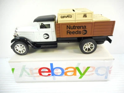 Винтажный Ertl Nutrena Feeds Международный Литой Банк Плоская Кровать Грузовик Новый из старых запасов - Изображение 1 из 4