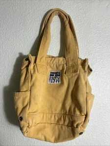 Bolso de Mano Converse All Start Amarillo Lona 12x12x7 - Imagen 1 de 24