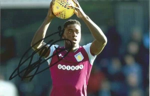ASTON VILLA: AXEL TUANZEBE SIGNED 6x4 ACTION PHOTO+COA - Picture 1 of 1