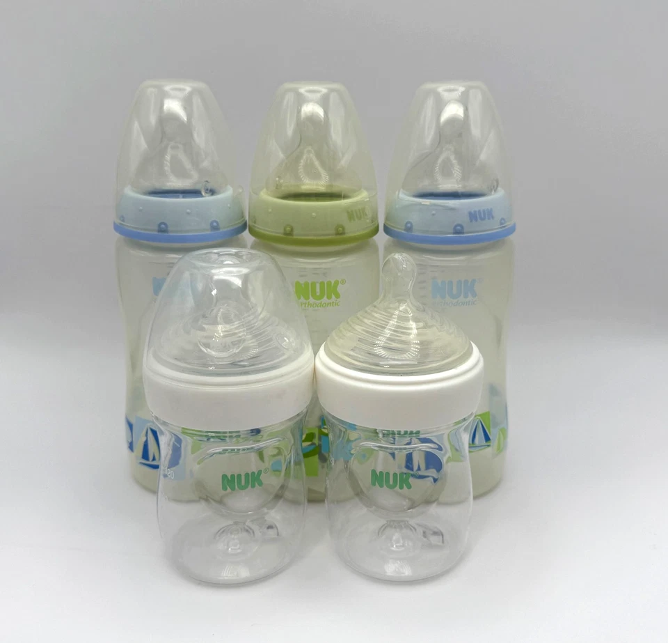 Lote de 5 biberones NUK - pezones de ortodoncia - tamaños mixtos - limpios usados Foto 1 de 1