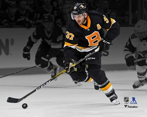 Patrice Bergeron Boston Bruins Unsigned Black Alt Jersey Skate Spotlight Photo Cover