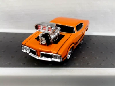 Muscle Machines Olds 442 Cutlass Orange Die Cast - Image 1 of 4