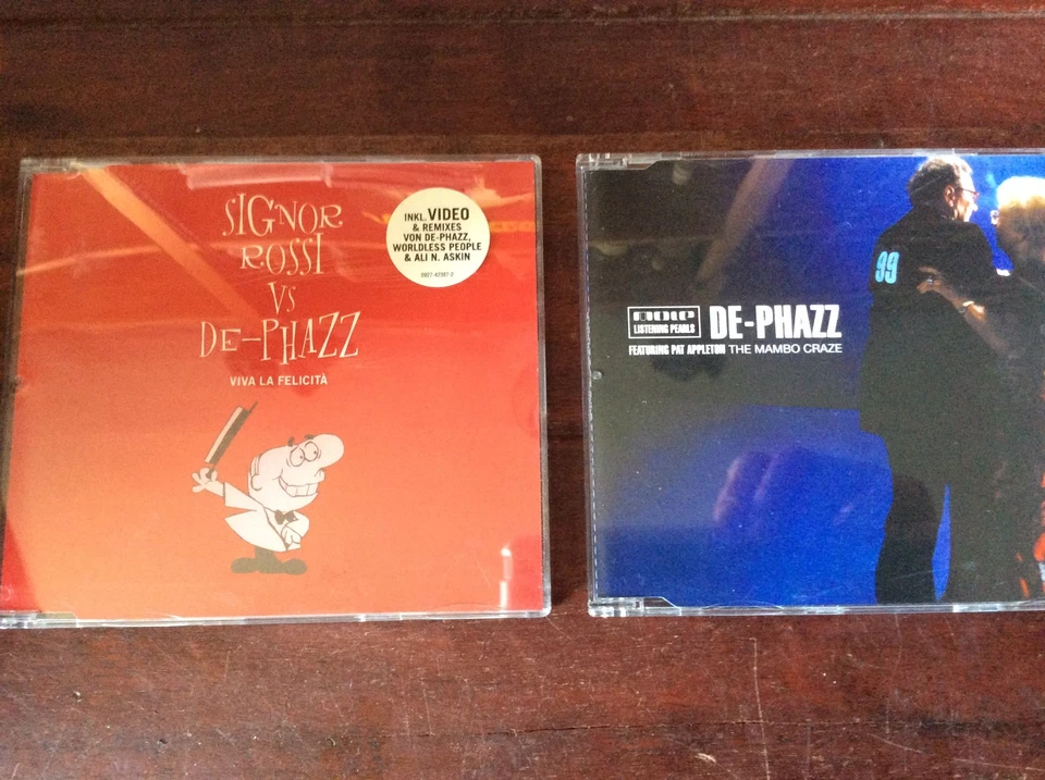 De-Phazz  [2 CD Maxi]  The Mambo Craze + Viva la Felicita   Signor Rossi - Bild 1 von 1