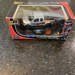 New Bright Industries 1:24 R/C Ford F-150 Raptor - Silver Orange #2490 (LM) nib - Picture 1 of 11