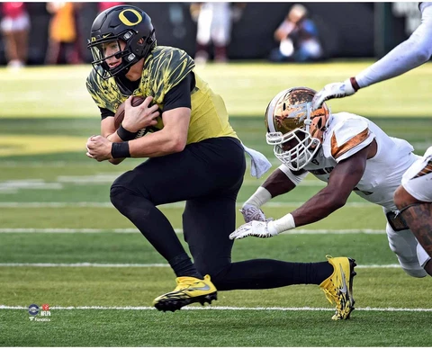 Justin Herbert Oregon Ducks UnSigned Yellow Jersey Run vs Arizona State Photo Cover