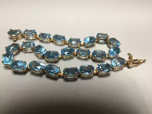 14k Gold 7" Tennis Style Bracelet with 24 Oval Cut Blue Topazs - Picture 1 of 8