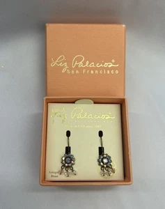 Pendientes colgantes flores Liz Palacios latón antiguo con cristal de Swarovski - Imagen 1 de 5