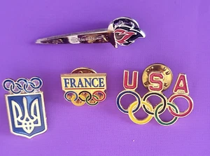 Vier Abzeichen Olympia Olympia Symbole USA Frankreich Ukraine - Bild 1 von 14