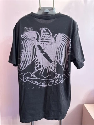 Camiseta masculina manga curta vintage Guess cinza escuro com design gráfico roxo M - Imagem 1 de 4