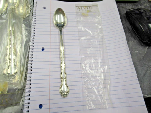 (1) New in Plastic Alvin Sterling French Scroll Iced Tea Spoon Sale Priced! WOW Cover