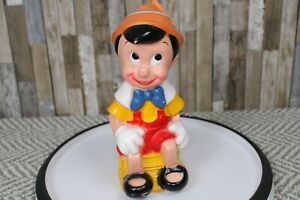 Pinnocchio Seated on Stack Book, Vintage Piggy Bank, Play Pal Plastics Blow Mold