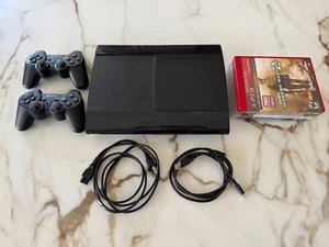Playstation 3 Super Slim (Great Condition - includes 2 controllers and 4 games) - Picture 1 of 6