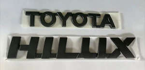 Toyota Hilux badge set genuine (dark metalic grey) 2015-2024 models - Picture 1 of 4