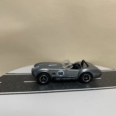Matchbox Best of International 1965 Shelby Cobra 427 S/C gris oscuro #98 1:57 casi nuevo Foto 1 de 4