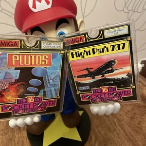 💾Amiga --Plutos Game + Flight 737 + GC + 2x Amiga Games - Afbeelding 1 van 7