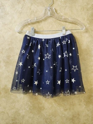 Falda corta Jumping Beans niñas talla 10 azul marino con medidas de estrellas plateadas con fotos Foto 1 de 4