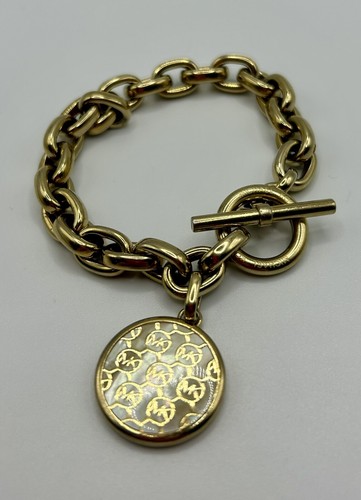 MICHAEL KORS Bracciale a levetta tono oro MK disco monogramma