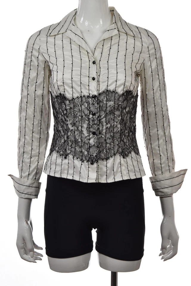 Blusa con botones de encaje floral blanca talla 0 de la colección Carmen Marc Valvo Foto 1 de 4