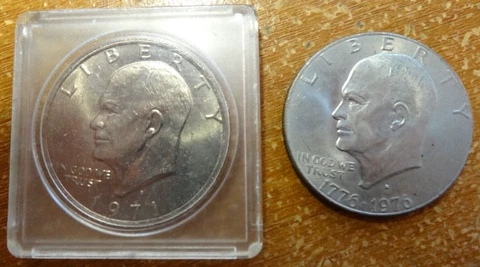 1971-D in Plastic Case & 1976-D  - Eisenhower Dollar Coins - Lot Of 2 Cover