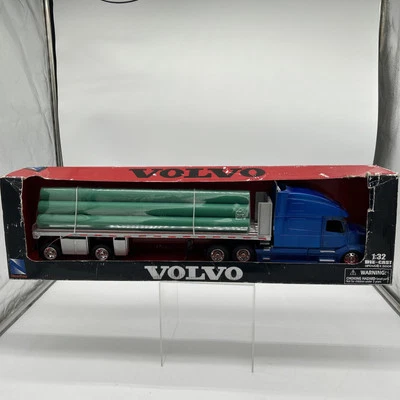 VOLVO VN-780 TRUCK W/FLATBED & LONG PIPES WHITE 1/32 DIECAST BY NEW RAY 14223 B - Image 1 of 4