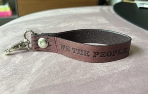 Cinturino da polso in pelle con scatto e clip - Noi il Popolo - Foto 1 di 5