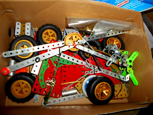 VINTAGE MECCANO ASSORTED SPARES AND WHEELS PLUS BOOK AND JAR