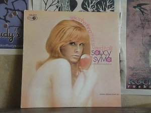 SAUCY SYLVIA STOUN, SEX IS THE THINGS - LP JGM 2063 NUDE CHEESECAKE - Bild 1 von 1