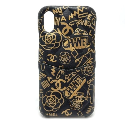 Funda CHANEL Camellia Matelasse iPhone X y XS Piel de becerro Negra x Dorada Foto 1 de 4