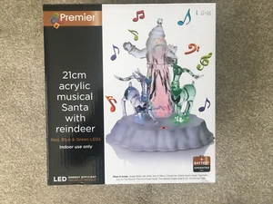 21cm ACRÍLICO MUSICAL SANTA CON RENOS - LED ROJO, AZUL Y VERDE de PREMIER - NUEVO - Imagen 1 de 4